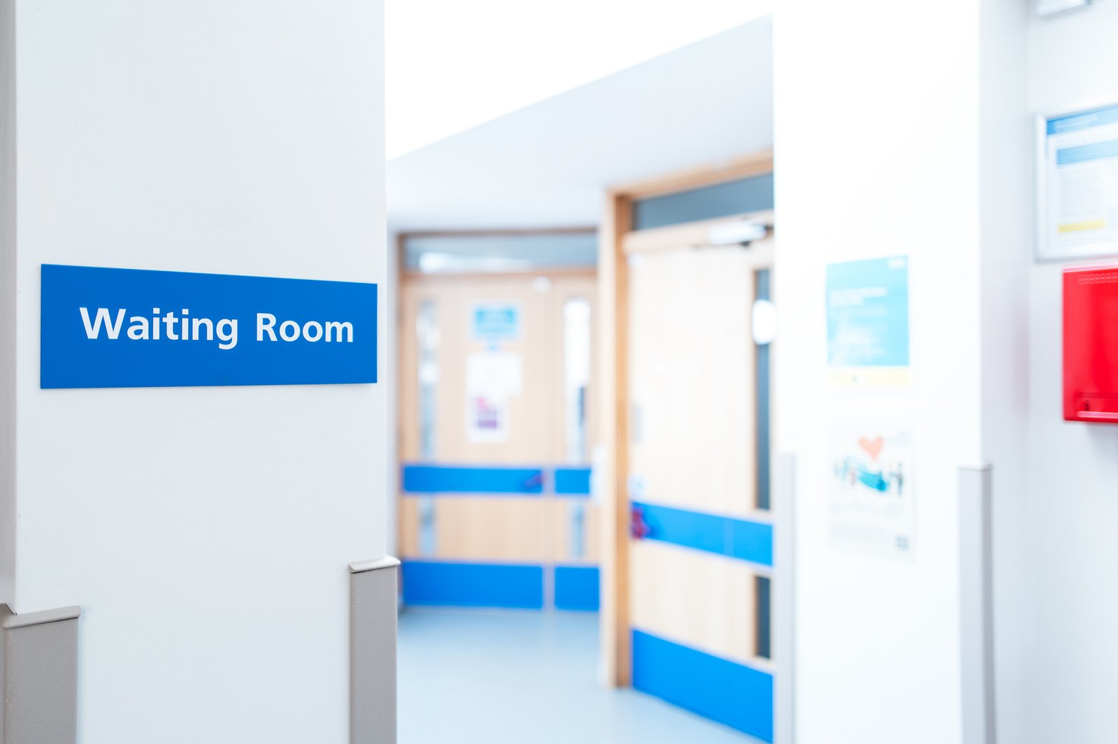 typical british hospital and gp waiting room sign seen within a patient's medical waiting area.
